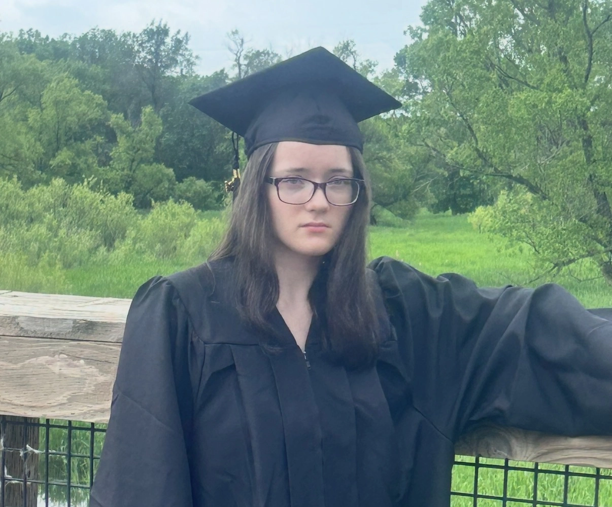Taylor in a graduation gown