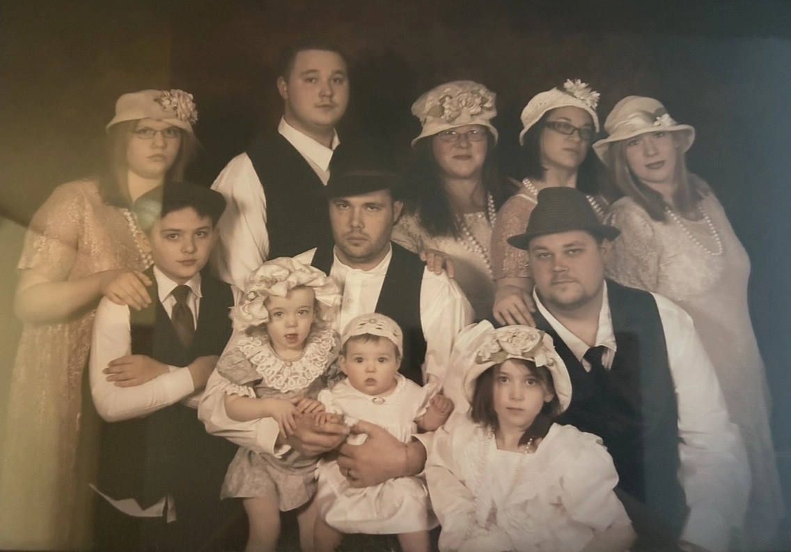 Taylor with family in an old-time style of dress